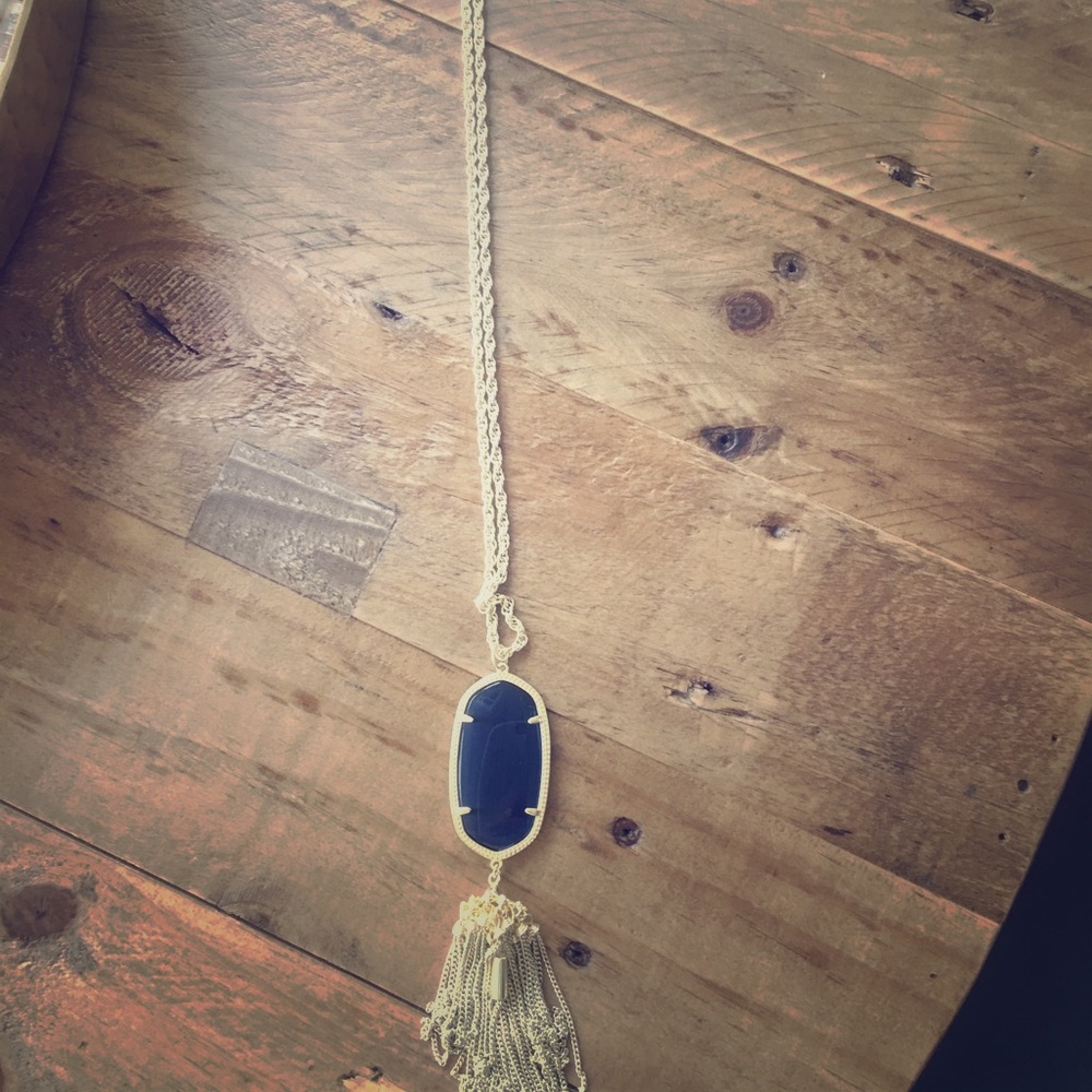 Kendra Scott blue and gold necklace.